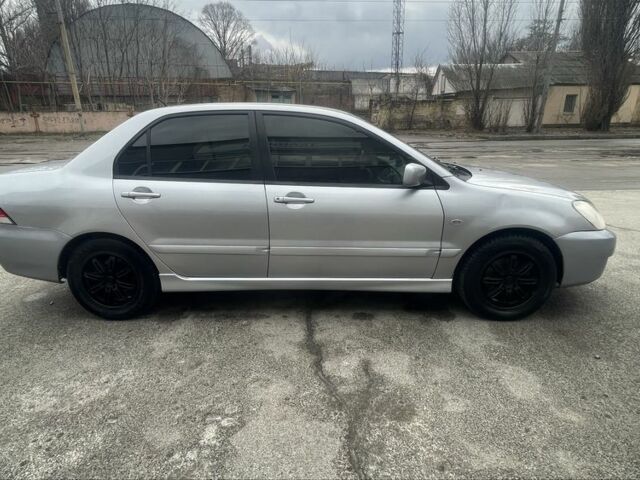 Сірий Міцубісі Lancer, об'ємом двигуна 1.6 л та пробігом 200 тис. км за 4200 $, фото 3 на Automoto.ua