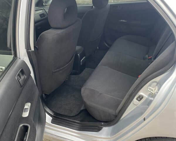 Серый Мицубиси Лансер, объемом двигателя 1.58 л и пробегом 240 тыс. км за 5500 $, фото 6 на Automoto.ua