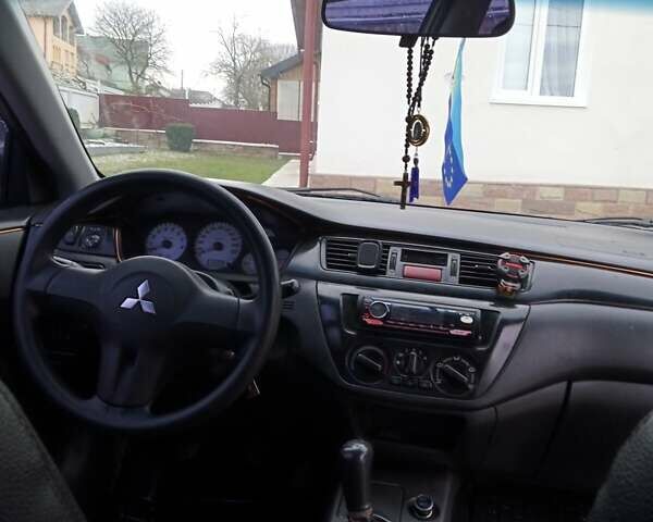 Сірий Міцубісі Lancer, об'ємом двигуна 1.6 л та пробігом 337 тис. км за 4600 $, фото 7 на Automoto.ua