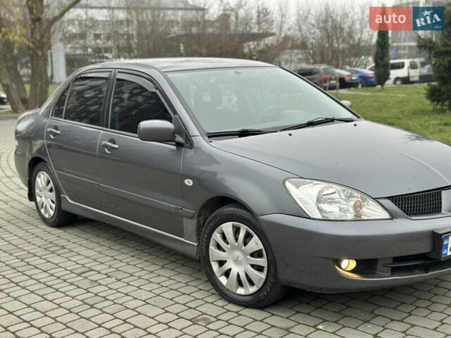 Сірий Міцубісі Lancer, об'ємом двигуна 1.6 л та пробігом 177 тис. км за 2800 $, фото 12 на Automoto.ua