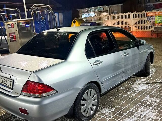 Сірий Міцубісі Lancer, об'ємом двигуна 1.6 л та пробігом 244 тис. км за 3900 $, фото 2 на Automoto.ua
