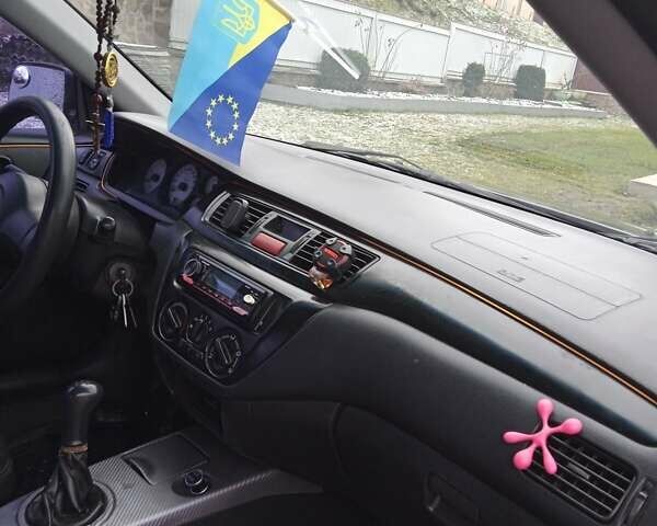 Сірий Міцубісі Lancer, об'ємом двигуна 1.6 л та пробігом 337 тис. км за 4600 $, фото 9 на Automoto.ua