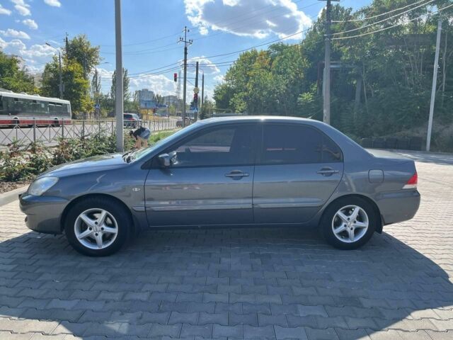 Серый Мицубиси Лансер, объемом двигателя 1.6 л и пробегом 161 тыс. км за 4800 $, фото 6 на Automoto.ua