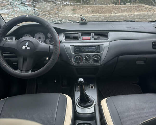 Сірий Міцубісі Lancer, об'ємом двигуна 1.58 л та пробігом 210 тис. км за 1300 $, фото 1 на Automoto.ua