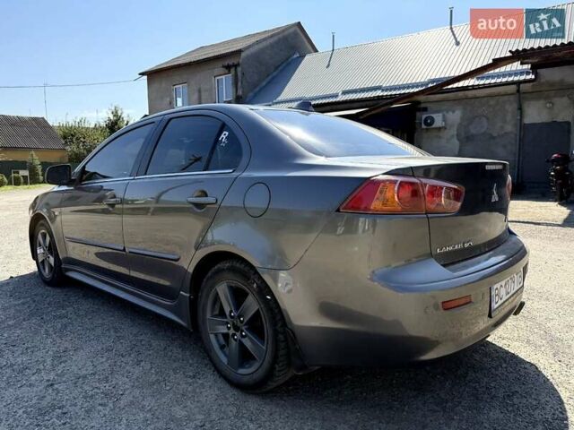 Сірий Міцубісі Lancer, об'ємом двигуна 2 л та пробігом 203 тис. км за 6200 $, фото 2 на Automoto.ua