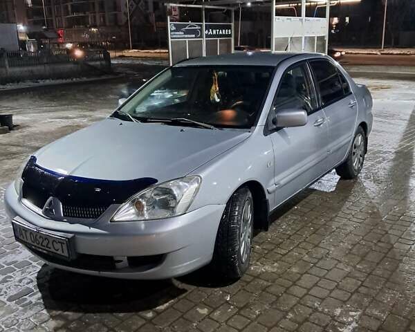 Сірий Міцубісі Lancer, об'ємом двигуна 1.58 л та пробігом 244 тис. км за 4500 $, фото 4 на Automoto.ua