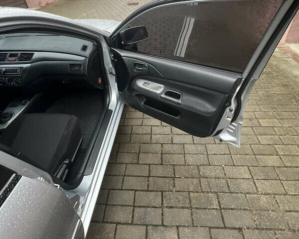 Серый Мицубиси Лансер, объемом двигателя 1.6 л и пробегом 254 тыс. км за 4500 $, фото 32 на Automoto.ua