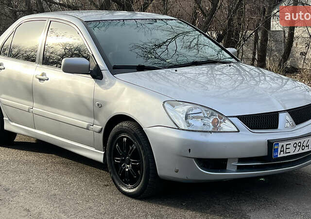 Серый Мицубиси Лансер, объемом двигателя 1.58 л и пробегом 290 тыс. км за 3750 $, фото 4 на Automoto.ua