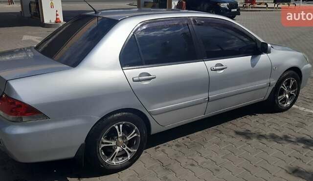 Серый Мицубиси Лансер, объемом двигателя 1.6 л и пробегом 420 тыс. км за 4900 $, фото 6 на Automoto.ua