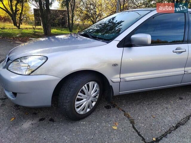 Сірий Міцубісі Lancer, об'ємом двигуна 1.58 л та пробігом 122 тис. км за 6300 $, фото 19 на Automoto.ua