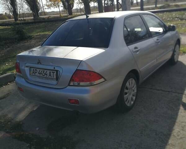 Сірий Міцубісі Lancer, об'ємом двигуна 1.6 л та пробігом 142 тис. км за 4700 $, фото 3 на Automoto.ua