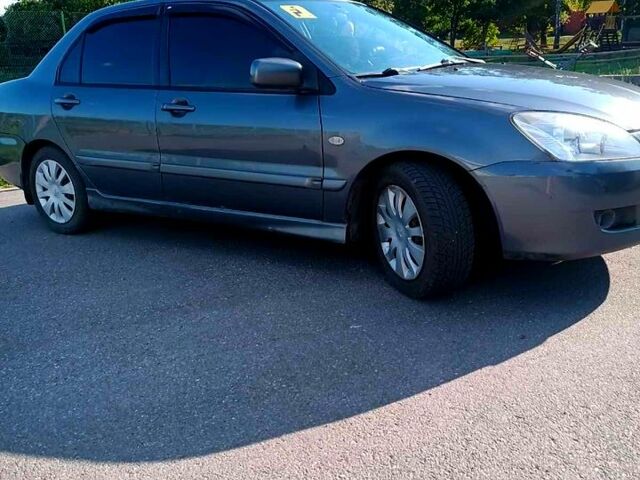 Сірий Міцубісі Lancer, об'ємом двигуна 1.6 л та пробігом 300 тис. км за 4400 $, фото 3 на Automoto.ua