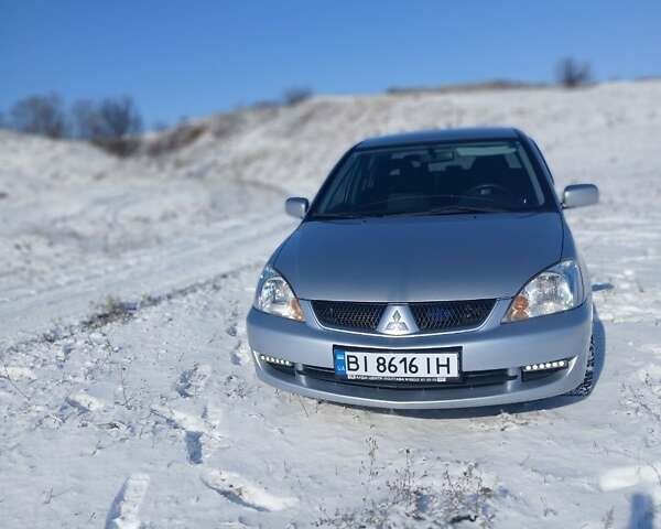 Серый Мицубиси Лансер, объемом двигателя 1.6 л и пробегом 277 тыс. км за 4599 $, фото 1 на Automoto.ua