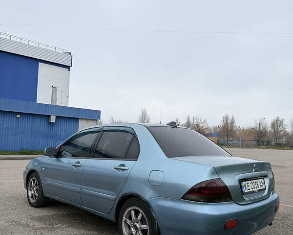 Серый Мицубиси Лансер, объемом двигателя 1.6 л и пробегом 238 тыс. км за 4400 $, фото 2 на Automoto.ua