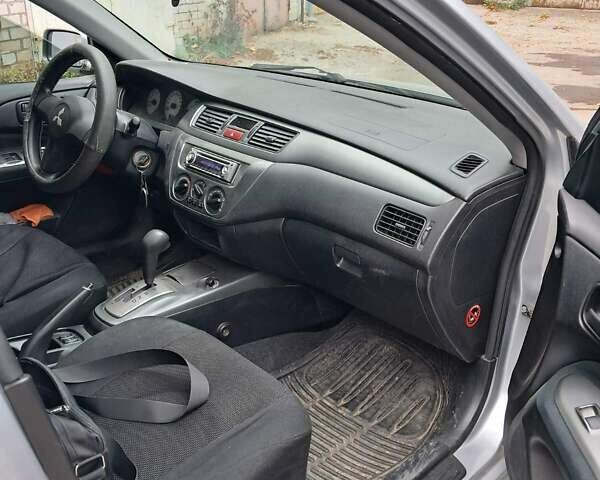Сірий Міцубісі Lancer, об'ємом двигуна 1.6 л та пробігом 122 тис. км за 5500 $, фото 4 на Automoto.ua