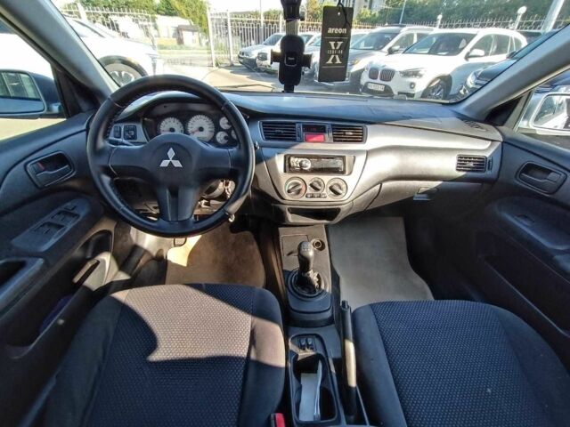 Серый Мицубиси Лансер, объемом двигателя 1.6 л и пробегом 222 тыс. км за 3890 $, фото 23 на Automoto.ua