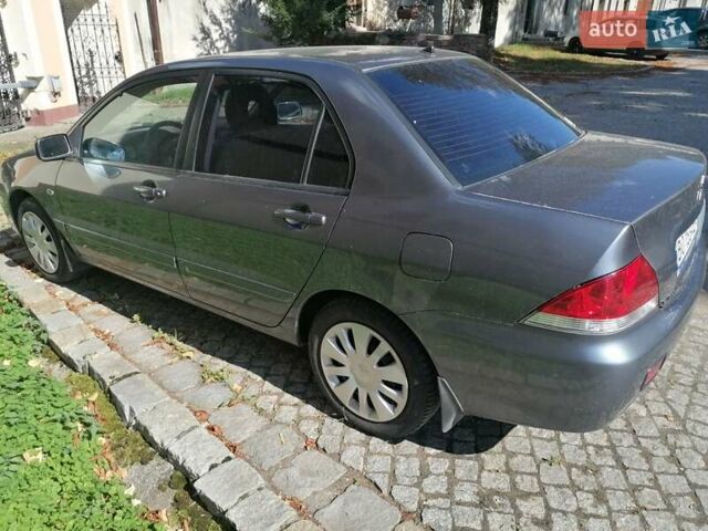Сірий Міцубісі Lancer, об'ємом двигуна 1.6 л та пробігом 205 тис. км за 3800 $, фото 6 на Automoto.ua