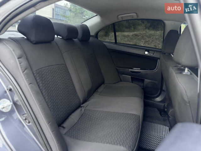 Сірий Міцубісі Lancer, об'ємом двигуна 2 л та пробігом 222 тис. км за 6300 $, фото 23 на Automoto.ua