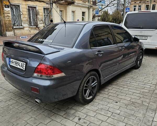 Серый Мицубиси Лансер, объемом двигателя 1.58 л и пробегом 260 тыс. км за 3700 $, фото 1 на Automoto.ua
