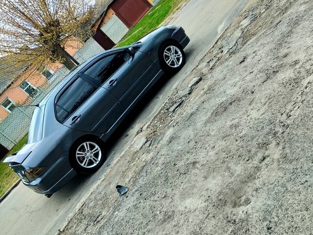 Сірий Міцубісі Lancer, об'ємом двигуна 2 л та пробігом 280 тис. км за 7000 $, фото 1 на Automoto.ua