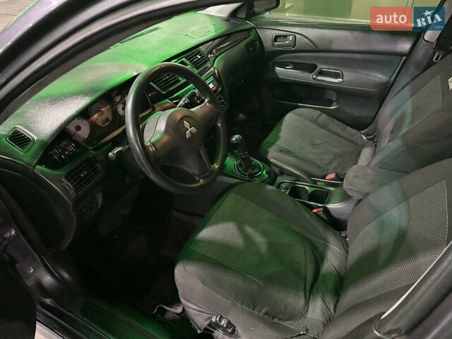 Серый Мицубиси Лансер, объемом двигателя 1.6 л и пробегом 112 тыс. км за 2800 $, фото 14 на Automoto.ua