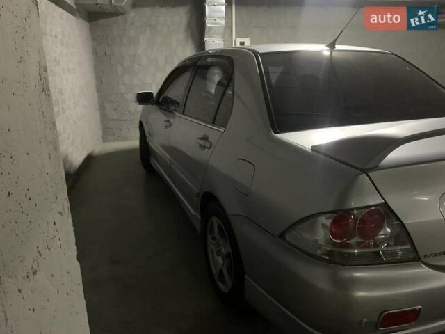 Серый Мицубиси Лансер, объемом двигателя 1.6 л и пробегом 196 тыс. км за 3800 $, фото 2 на Automoto.ua