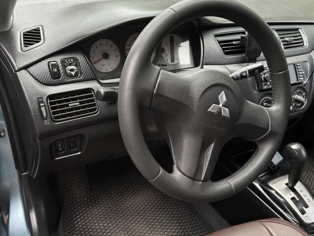 Серый Мицубиси Лансер, объемом двигателя 1.6 л и пробегом 238 тыс. км за 4300 $, фото 12 на Automoto.ua