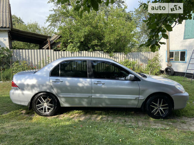 Сірий Міцубісі Lancer, об'ємом двигуна 1.6 л та пробігом 250 тис. км за 5500 $, фото 5 на Automoto.ua