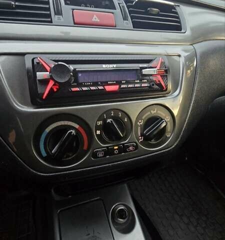 Сірий Міцубісі Lancer, об'ємом двигуна 1.6 л та пробігом 213 тис. км за 3600 $, фото 24 на Automoto.ua