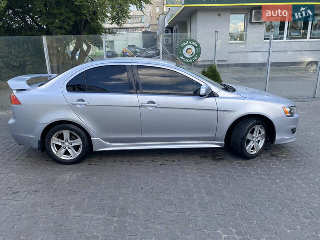 Серый Мицубиси Лансер, объемом двигателя 2 л и пробегом 215 тыс. км за 5750 $, фото 1 на Automoto.ua