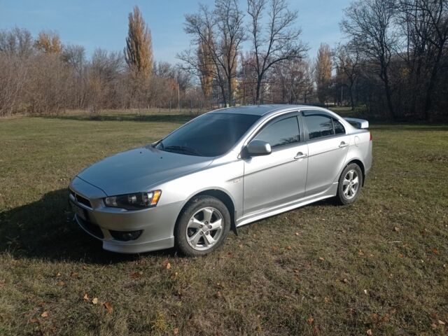 Серый Мицубиси Лансер, объемом двигателя 2 л и пробегом 180 тыс. км за 5800 $, фото 9 на Automoto.ua