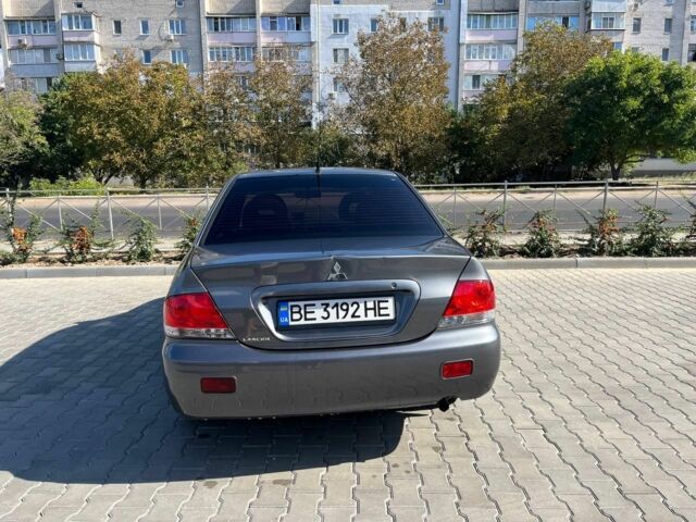 Серый Мицубиси Лансер, объемом двигателя 1.6 л и пробегом 161 тыс. км за 4800 $, фото 5 на Automoto.ua