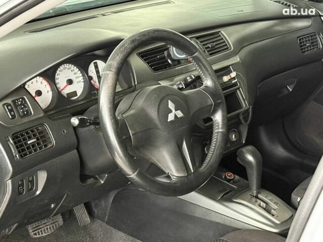Серый Мицубиси Лансер, объемом двигателя 1.6 л и пробегом 174 тыс. км за 5990 $, фото 7 на Automoto.ua