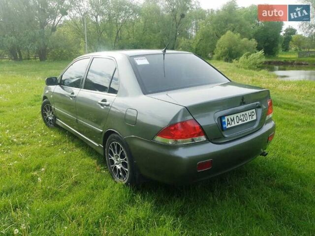 Сірий Міцубісі Lancer, об'ємом двигуна 1.58 л та пробігом 220 тис. км за 4500 $, фото 6 на Automoto.ua