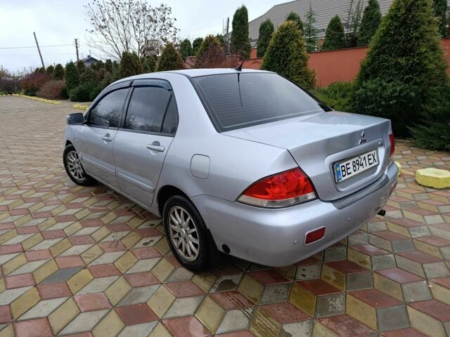 Серый Мицубиси Лансер, объемом двигателя 1.6 л и пробегом 238 тыс. км за 2900 $, фото 3 на Automoto.ua