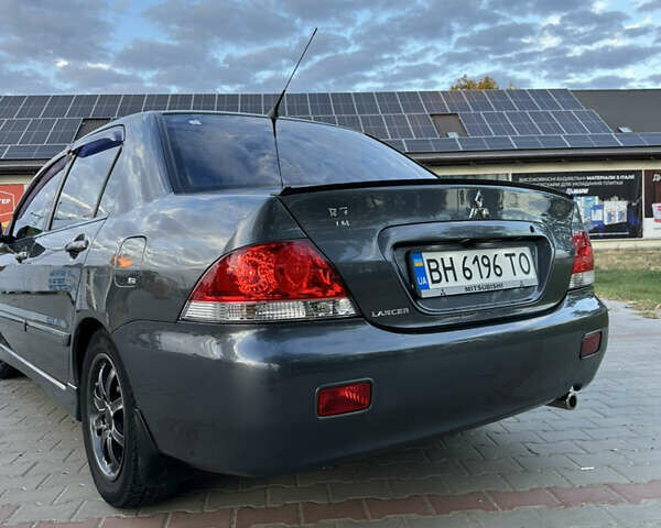Сірий Міцубісі Lancer, об'ємом двигуна 1.6 л та пробігом 189 тис. км за 6200 $, фото 3 на Automoto.ua