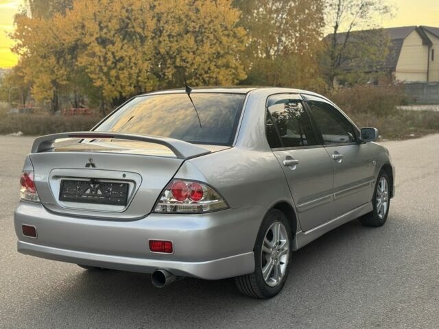 Серый Мицубиси Лансер, объемом двигателя 2 л и пробегом 185 тыс. км за 4600 $, фото 4 на Automoto.ua