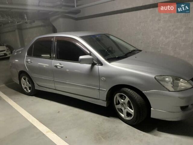 Серый Мицубиси Лансер, объемом двигателя 1.6 л и пробегом 196 тыс. км за 3800 $, фото 4 на Automoto.ua