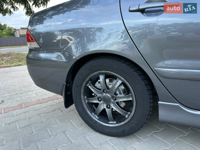 Сірий Міцубісі Lancer, об'ємом двигуна 1.6 л та пробігом 189 тис. км за 6200 $, фото 8 на Automoto.ua