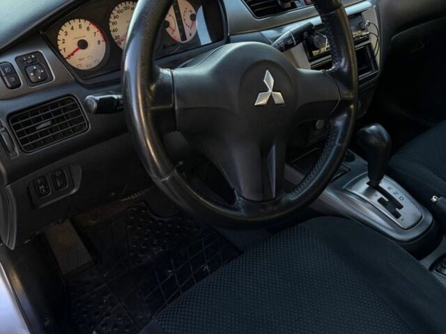 Сірий Міцубісі Lancer, об'ємом двигуна 1.6 л та пробігом 174 тис. км за 4800 $, фото 4 на Automoto.ua