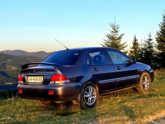 Сірий Міцубісі Lancer, об'ємом двигуна 1.6 л та пробігом 240 тис. км за 4450 $, фото 2 на Automoto.ua