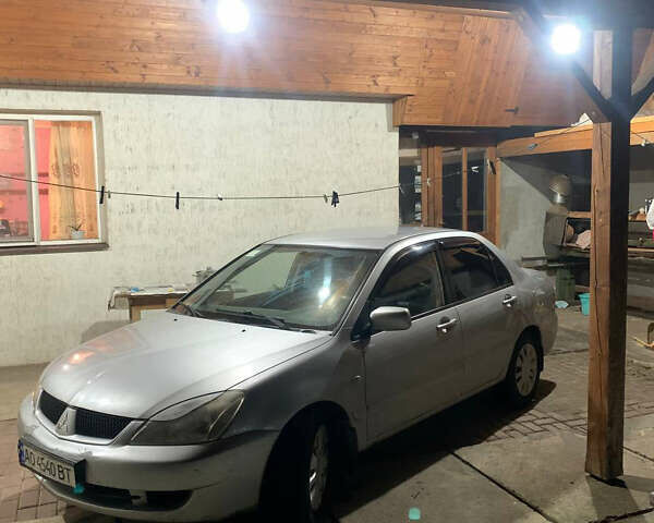 Сірий Міцубісі Lancer, об'ємом двигуна 1.58 л та пробігом 320 тис. км за 4000 $, фото 1 на Automoto.ua