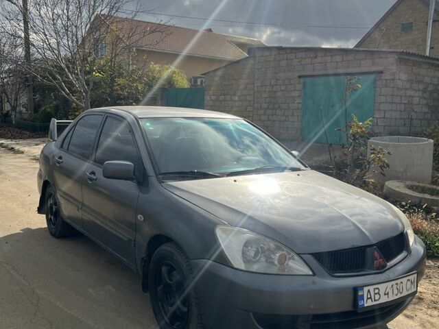 Серый Мицубиси Лансер, объемом двигателя 1.6 л и пробегом 200 тыс. км за 2300 $, фото 3 на Automoto.ua