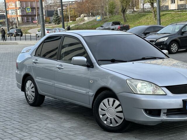 Сірий Міцубісі Lancer, об'ємом двигуна 1.6 л та пробігом 200 тис. км за 3900 $, фото 5 на Automoto.ua