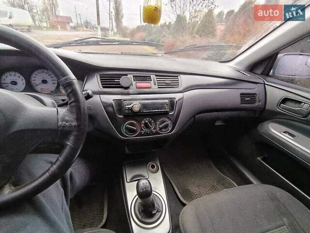 Серый Мицубиси Лансер, объемом двигателя 1.6 л и пробегом 268 тыс. км за 2900 $, фото 7 на Automoto.ua