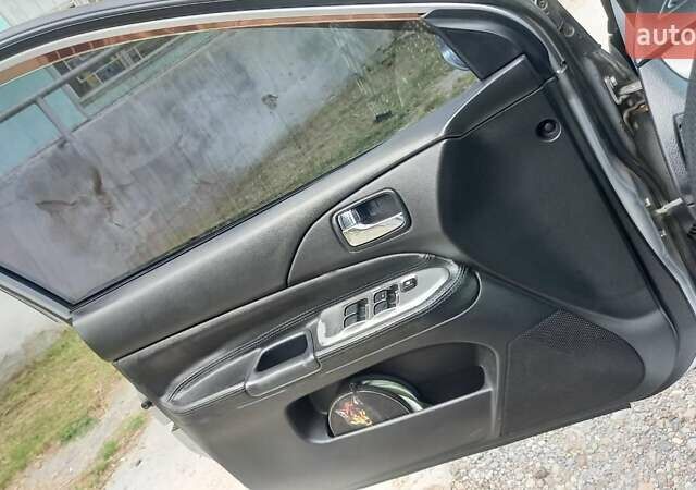 Сірий Міцубісі Lancer, об'ємом двигуна 1.6 л та пробігом 298 тис. км за 4100 $, фото 18 на Automoto.ua
