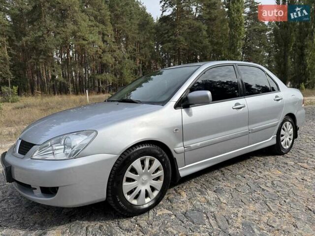 Серый Мицубиси Лансер, объемом двигателя 1.6 л и пробегом 200 тыс. км за 4400 $, фото 1 на Automoto.ua