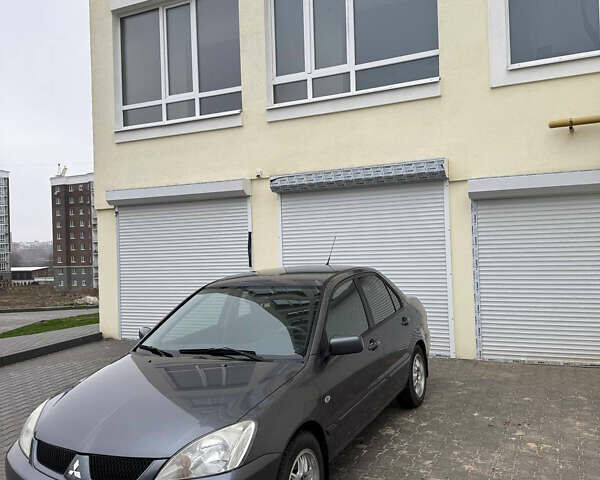 Серый Мицубиси Лансер, объемом двигателя 1.58 л и пробегом 187 тыс. км за 4800 $, фото 3 на Automoto.ua