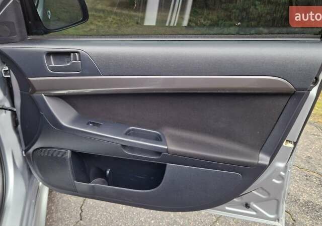 Серый Мицубиси Лансер, объемом двигателя 2 л и пробегом 213 тыс. км за 6550 $, фото 16 на Automoto.ua