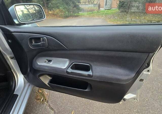 Сірий Міцубісі Lancer, об'ємом двигуна 1.6 л та пробігом 213 тис. км за 3600 $, фото 28 на Automoto.ua